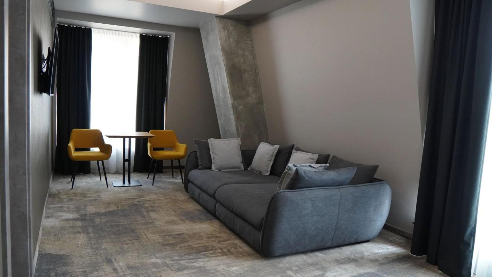 Aniroc Signature Hotel Arad Bagian luar foto A 3D rendering of a living room